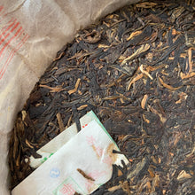Load image into Gallery viewer, 2006 LiMing "Qiao Mu Gong Rui" (Tribute Arbor Tree - Bu Lang) Cake 357g Puerh Raw Tea Sheng Cha, Meng Hai.