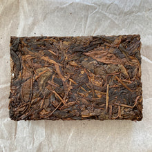 Load image into Gallery viewer, 2014 KingTeaMall "Yi Wu - Gua Feng Zhai - Huang Pian" (Yiwu - GuaFengZhai - Huangpian / Yellow Leaf) Brick 250g Puerh Raw Tea Sheng Cha