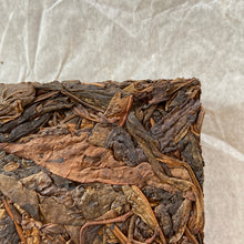 Load image into Gallery viewer, 2014 KingTeaMall "Yi Wu - Gua Feng Zhai - Huang Pian" (Yiwu - GuaFengZhai - Huangpian / Yellow Leaf) Brick 250g Puerh Raw Tea Sheng Cha