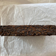 Load image into Gallery viewer, 2014 KingTeaMall "Yi Wu - Gua Feng Zhai - Huang Pian" (Yiwu - GuaFengZhai - Huangpian / Yellow Leaf) Brick 250g Puerh Raw Tea Sheng Cha