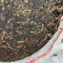 Load image into Gallery viewer, 2012 XiaGuan &quot;Ban Zhang Qiao Mu Lao Shu&quot; (Banzhang Arbor Old Tree) Cake 357g Puerh Raw Tea Sheng Cha