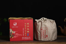 Load image into Gallery viewer, 2017 XiaGuan "Dong Fang Zhi Zhu - Bu Lang Gu Shu" (Oriental Pearl - Bulang Old Tree) Iron Cake 357g Puerh Shou Cha Ripe Tea