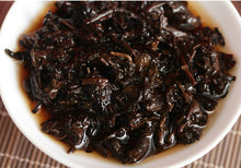 Load image into Gallery viewer, 2017 XiaGuan &quot;Dong Fang Zhi Zhu - Bu Lang Gu Shu&quot; (Oriental Pearl - Bulang Old Tree) Iron Cake 357g Puerh Shou Cha Ripe Tea