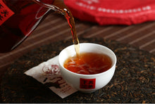Load image into Gallery viewer, 2017 XiaGuan "Dong Fang Zhi Zhu - Bu Lang Gu Shu" (Oriental Pearl - Bulang Old Tree) Iron Cake 357g Puerh Shou Cha Ripe Tea