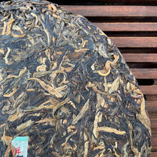 Load image into Gallery viewer, 2006 LiMing "Bu Lang Shan - Qiao Mu Gu Shu - Nv Er Gong Bing" (Bulang Mountain - Ancient Arbor Tree - Tribute Tea) Cake 250g Puerh Raw Tea Sheng Cha