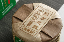 Load image into Gallery viewer, 2017 XiaGuan &quot;Dong Fang Zhi Zhu - Bu Lang Gu Shu&quot; (Oriental Pearl - Bulang Old Tree) Iron Cake 357g Puerh Sheng Cha Raw Tea
