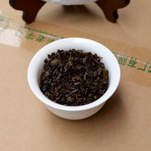 Load image into Gallery viewer, 500g Cake Dark Tea · Wuzhou, Guangxi**

Name: Liu Bao Tea – Pressed Cake “20060”
Brand: Sanhe (Three Cranes / Wuzhou Tea Factory)
Grade: Special Grade (Te Ji)
Form: Pressed Tea Cake
Specification: 500g per cake · 6 cakes per bundle · 24 cakes per carton
Aroma Profile: Betel-nut aroma · Fungal/“Golden Flower” floral aroma
Aging Start Date: December 25, 2020
Production Date: January 8, 2024

⸻

Product Description

The 20060 Liu Bao tea cake is produced by Wuzhou Tea Factory using carefully selected 2020 spri