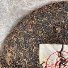 Load image into Gallery viewer, 2009 XiaGuan "T8633" Iron Cake 357g Puerh Raw Tea Sheng Cha