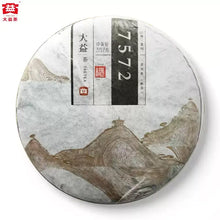 Load image into Gallery viewer, Chinese puerh tea cake wrapped in paper with landscape art and Chinese text, labeled 7572.