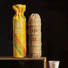 Load image into Gallery viewer, Chinese tea bamboo leaf wrapped bundle and yellow cloth tea bag with teacup on wood shelf