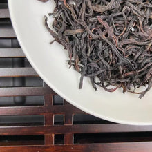 Load image into Gallery viewer, From the mist-shrouded peaks of Wu Dong Mountain, the historic heart of Phoenix Single Bush in Chaozhou, Guangdong, comes one of the most sought-after DanCong lots of the 2024 spring harvest: “Dong Fang Hong” – Eastern Red.

Grown at 1,100–1,250 m altitude on ancient, wild-arbor tea trees (some exceeding 100 years), this S+ grade selection is hand-picked in mid-April from the celebrated “MiLan Xiang” (Honey-Orchid Fragrance) cultivar lineage. Only the finest one-bud-two-leaf sets are chosen, ensuring extrao