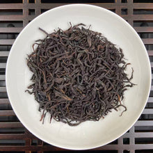 Load image into Gallery viewer, From the mist-shrouded peaks of Wu Dong Mountain, the historic heart of Phoenix Single Bush in Chaozhou, Guangdong, comes one of the most sought-after DanCong lots of the 2024 spring harvest: “Dong Fang Hong” – Eastern Red.

Grown at 1,100–1,250 m altitude on ancient, wild-arbor tea trees (some exceeding 100 years), this S+ grade selection is hand-picked in mid-April from the celebrated “MiLan Xiang” (Honey-Orchid Fragrance) cultivar lineage. Only the finest one-bud-two-leaf sets are chosen, ensuring extrao