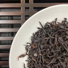 Load image into Gallery viewer, From the mist-shrouded peaks of Wu Dong Mountain, the historic heart of Phoenix Single Bush in Chaozhou, Guangdong, comes one of the most sought-after DanCong lots of the 2024 spring harvest: “Dong Fang Hong” – Eastern Red.

Grown at 1,100–1,250 m altitude on ancient, wild-arbor tea trees (some exceeding 100 years), this S+ grade selection is hand-picked in mid-April from the celebrated “MiLan Xiang” (Honey-Orchid Fragrance) cultivar lineage. Only the finest one-bud-two-leaf sets are chosen, ensuring extrao