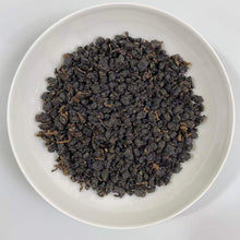 Load image into Gallery viewer, Appearance Tight, neatly curled dark-brown tea threads with a lustrous, slightly reddish sheen. The dry leaves release an inviting natural fragrance the moment the bag is opened.

Liquor Bright, clear amber with a reddish-golden glow.

Aroma &amp; Flavor Rich honey-like sweetness layered with ripe fruit (stone fruit, longan) and delicate floral notes. The taste is smooth and full-bodied, naturally sweet, with minimal bitterness and a pleasant, mouth-watering quality. It produces abundant saliva and delivers
