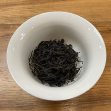 Load image into Gallery viewer, Appearance Bold, tightly twisted dark threads. Dry leaves give off an intense, natural aroma of dark cocoa, malt, ripe cherries, and a touch of molasses.

Liquor Deep, glowing reddish-copper with excellent clarity and brightness.

Aroma &amp; Taste Profile

Rich malt and cocoa body – the true hallmark of top Assam
Pronounced dark honey and sun-ripened stone fruit (plum &amp; longan)
Natural caramel-like sweetness with gentle, pleasant briskness
Full-bodied, thick mouthfeel and strong, warming cha qi
Long, s