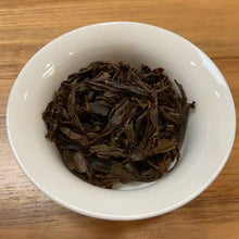 Load image into Gallery viewer, Appearance Bold, tightly twisted dark threads. Dry leaves give off an intense, natural aroma of dark cocoa, malt, ripe cherries, and a touch of molasses.

Liquor Deep, glowing reddish-copper with excellent clarity and brightness.

Aroma &amp; Taste Profile

Rich malt and cocoa body – the true hallmark of top Assam
Pronounced dark honey and sun-ripened stone fruit (plum &amp; longan)
Natural caramel-like sweetness with gentle, pleasant briskness
Full-bodied, thick mouthfeel and strong, warming cha qi
Long, s