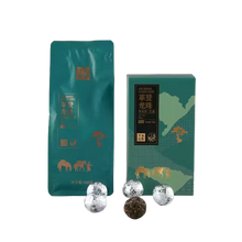 Carica l'immagine nel visualizzatore di Gallery, Puerh tea dragon pearl balls with teal packaging featuring gold graphics and Chinese text