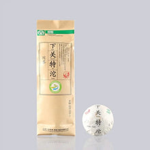 Load image into Gallery viewer, Chinese puerh tea bag and wrapped tuocha tea ball on light background
