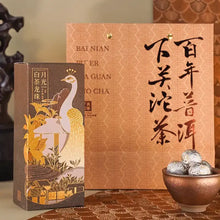 Load image into Gallery viewer, Elegant Chinese tea gift set with peacock-illustrated box, decorative bag, and tea balls in bowl