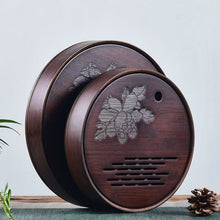 Load image into Gallery viewer, Product Name: Round Tea Tray

Material: Bamboo + Laminate Board Base

Size:

Small : Diameter 25 * Height 5 cm

Medium: Diameter 29 * Height 5 cm

Large : Diameter 38 * Height 5 cm



This Round Tea Tray is an exquisite piece of craftsmanship, designed for the ritual of Gongfu tea, a traditional Chinese method of tea preparation that focuses on the aesthetic presentation and sharing. The tray is constructed from high-quality bamboo, a material revered for its durability and natural beauty.

The surface of t
