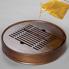 Load image into Gallery viewer, Product Name: Round Tea Tray

Material: Bamboo + Laminate Board Base

Size:

Small : Diameter 25 * Height 5 cm

Medium: Diameter 29 * Height 5 cm

Large : Diameter 38 * Height 5 cm



This Round Tea Tray is an exquisite piece of craftsmanship, designed for the ritual of Gongfu tea, a traditional Chinese method of tea preparation that focuses on the aesthetic presentation and sharing. The tray is constructed from high-quality bamboo, a material revered for its durability and natural beauty.

The surface of t