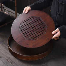 Load image into Gallery viewer, Product Name: Round Tea Tray

Material: Bamboo + Laminate Board Base

Size:

Small : Diameter 25 * Height 5 cm

Medium: Diameter 29 * Height 5 cm

Large : Diameter 38 * Height 5 cm



This Round Tea Tray is an exquisite piece of craftsmanship, designed for the ritual of Gongfu tea, a traditional Chinese method of tea preparation that focuses on the aesthetic presentation and sharing. The tray is constructed from high-quality bamboo, a material revered for its durability and natural beauty.

The surface of t