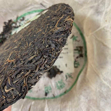 Load image into Gallery viewer, 2004 LiMing "Nan Huo Shan · Chun · Gu Qiao Mu" (Nannuo Mountain · Spring · Old Arbor Tree) Cake 357g Puerh Raw Tea Sheng Cha