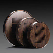 Load image into Gallery viewer, Product Name: Round Tea Tray

Material: Bamboo + Laminate Board Base

Size:

Small : Diameter 25 * Height 5 cm

Medium: Diameter 29 * Height 5 cm

Large : Diameter 38 * Height 5 cm



This Round Tea Tray is an exquisite piece of craftsmanship, designed for the ritual of Gongfu tea, a traditional Chinese method of tea preparation that focuses on the aesthetic presentation and sharing. The tray is constructed from high-quality bamboo, a material revered for its durability and natural beauty.

The surface of t