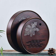 Load image into Gallery viewer, Product Name: Round Tea Tray

Material: Bamboo + Laminate Board Base

Size:

Small : Diameter 25 * Height 5 cm

Medium: Diameter 29 * Height 5 cm

Large : Diameter 38 * Height 5 cm



This Round Tea Tray is an exquisite piece of craftsmanship, designed for the ritual of Gongfu tea, a traditional Chinese method of tea preparation that focuses on the aesthetic presentation and sharing. The tray is constructed from high-quality bamboo, a material revered for its durability and natural beauty.

The surface of t