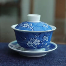 Load image into Gallery viewer, Blue and white porcelain gaiwan with floral plum blossom design for Chinese tea brewing