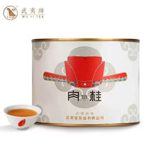 Load image into Gallery viewer, Wuyi Rou Gui oolong tea tin with traditional Chinese artwork and a cup of brewed tea