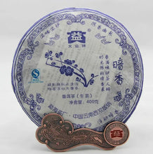 Load image into Gallery viewer, Yunnan raw puerh tea cake with blue floral Chinese design, 400g, displayed upright with tea coin