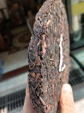 Load image into Gallery viewer, 2010 XiaGuan "Sheng Tai Lao Shu" (Organic Old Tree) Iron Cake 357g Puerh Raw Tea Sheng Cha - King Tea Mall