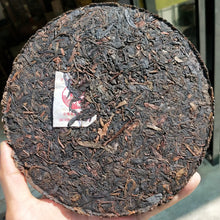 Load image into Gallery viewer, 2010 XiaGuan "Sheng Tai Lao Shu" (Organic Old Tree) Iron Cake 357g Puerh Raw Tea Sheng Cha - King Tea Mall