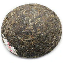 Load image into Gallery viewer, Compressed Chinese puerh tea cake, whole leaf, round shape