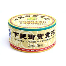 Load image into Gallery viewer, Chinese Pu-erh tea cake in round yellow tin, 200g, with Chinese and English text label