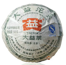 Load image into Gallery viewer, Wrapped Sheng Pu-erh tea cake with Taetea branding and Chinese text, 100g size