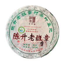 Load image into Gallery viewer, 2019 Chinese raw puerh tea cake, round pressed leaf disk with green and red Chinese text