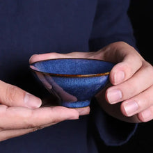 Load image into Gallery viewer, Hands holding a blue ceramic gaiwan or Chinese tea cup for gongfu tea ceremony